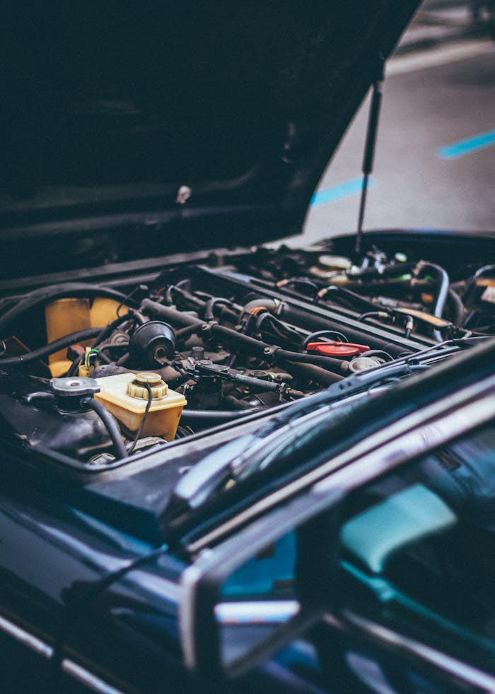 Home Detailed view of an exposed car engine under maintenance in Barcelona.